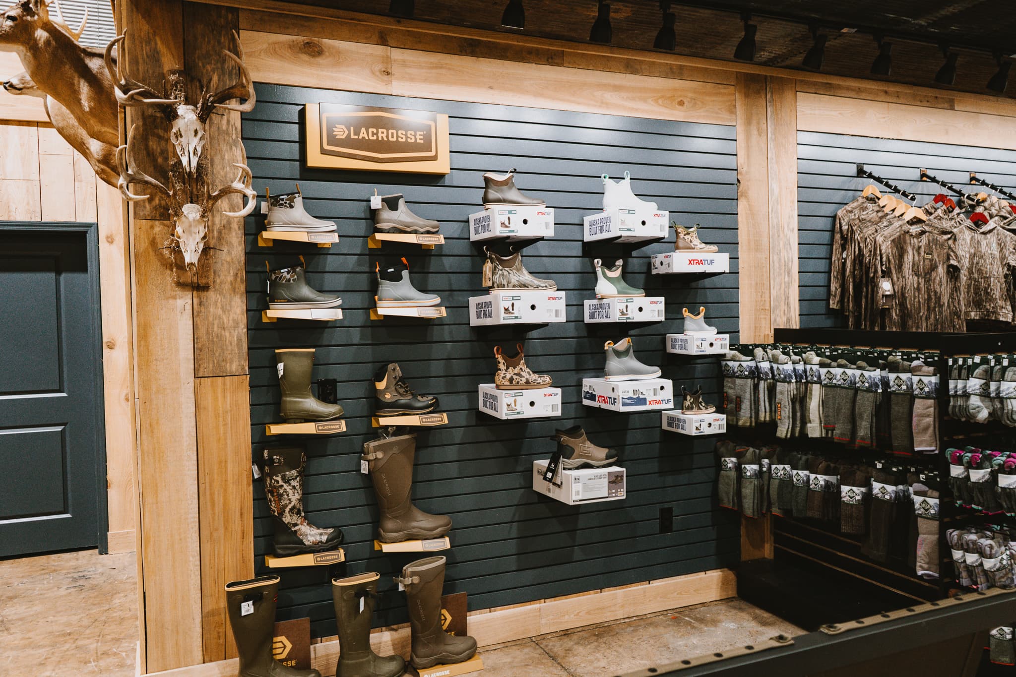 Outdoor apparel and lifestyle products displayed inside Sip Outdoors